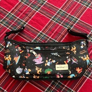 Disney Parks Stroller Organizer featuring an allover character print. GUC